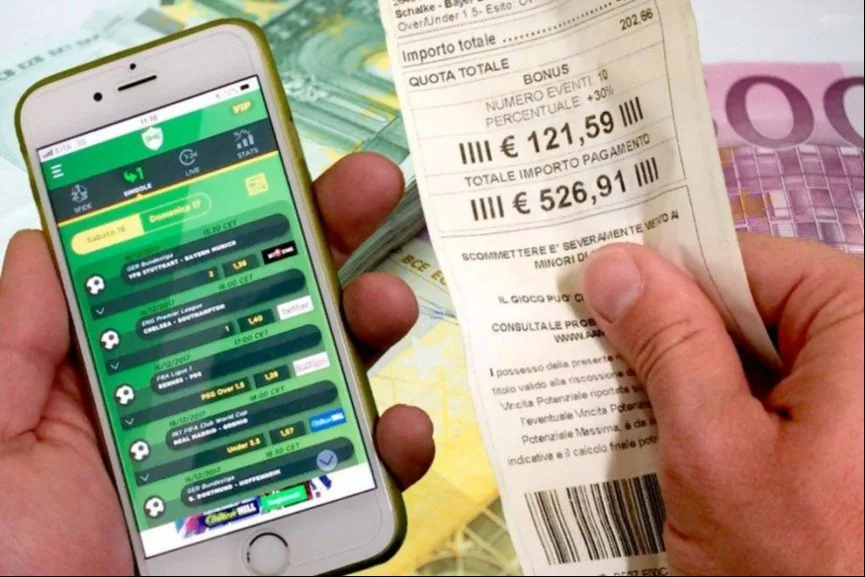 football betting odds displayed on smartphone with cash